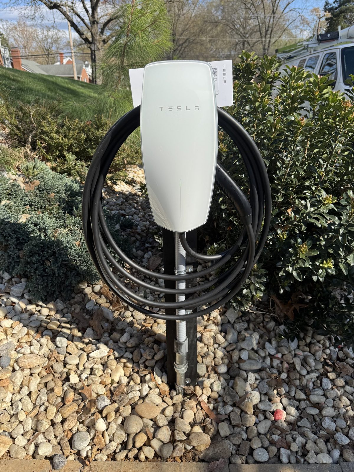 Tesla Wall Connector installed on a post by GreenKey