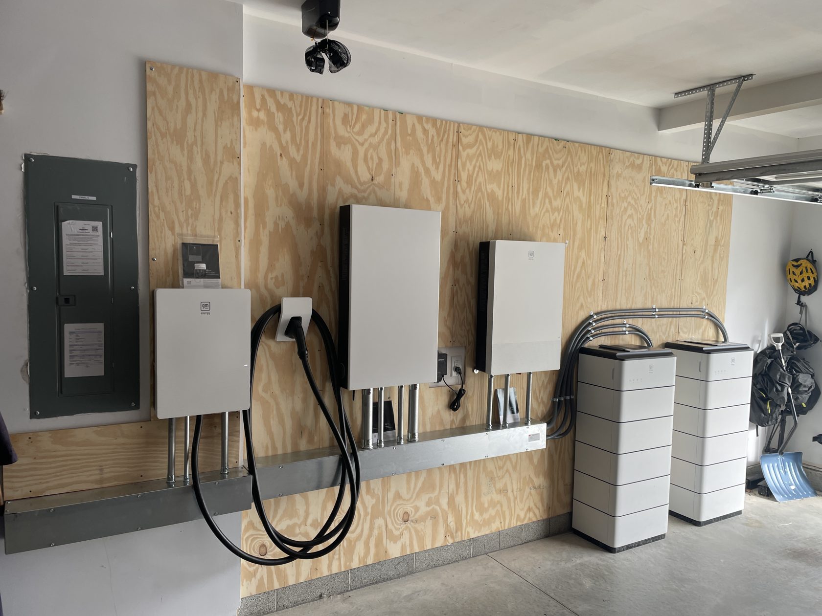 Complete GM Energy vehicle-to-home system — home hub, bidirectional charger, inverters, and PowerBank batteries — installed by GreenKey